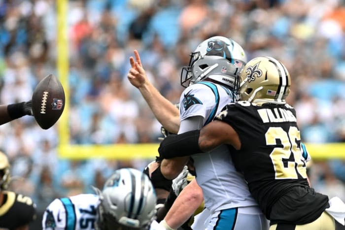 Carolina quarterback Sam Darnold (14) throws an interception as Saints cornerback P.J. Williams (26) pressures. Mandatory Credit: Bob Donnan-USA TODAY